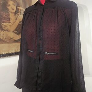 black sheer polkadot button up woman's blouse with long sleeves. Suzy Shier